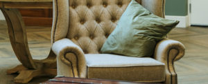 closeup of comfortable chair with a pillow