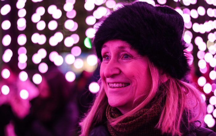 senior woman enjoying winter activities with a happy smile