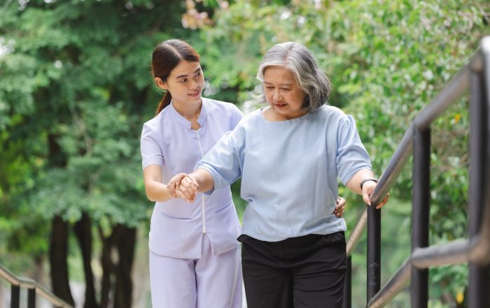 nurse taking care of elderly patient
